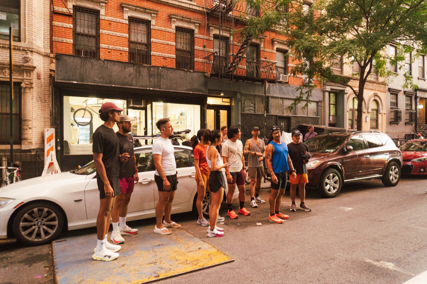 Runners lined up on a city street at the start of Supermarket Race 1